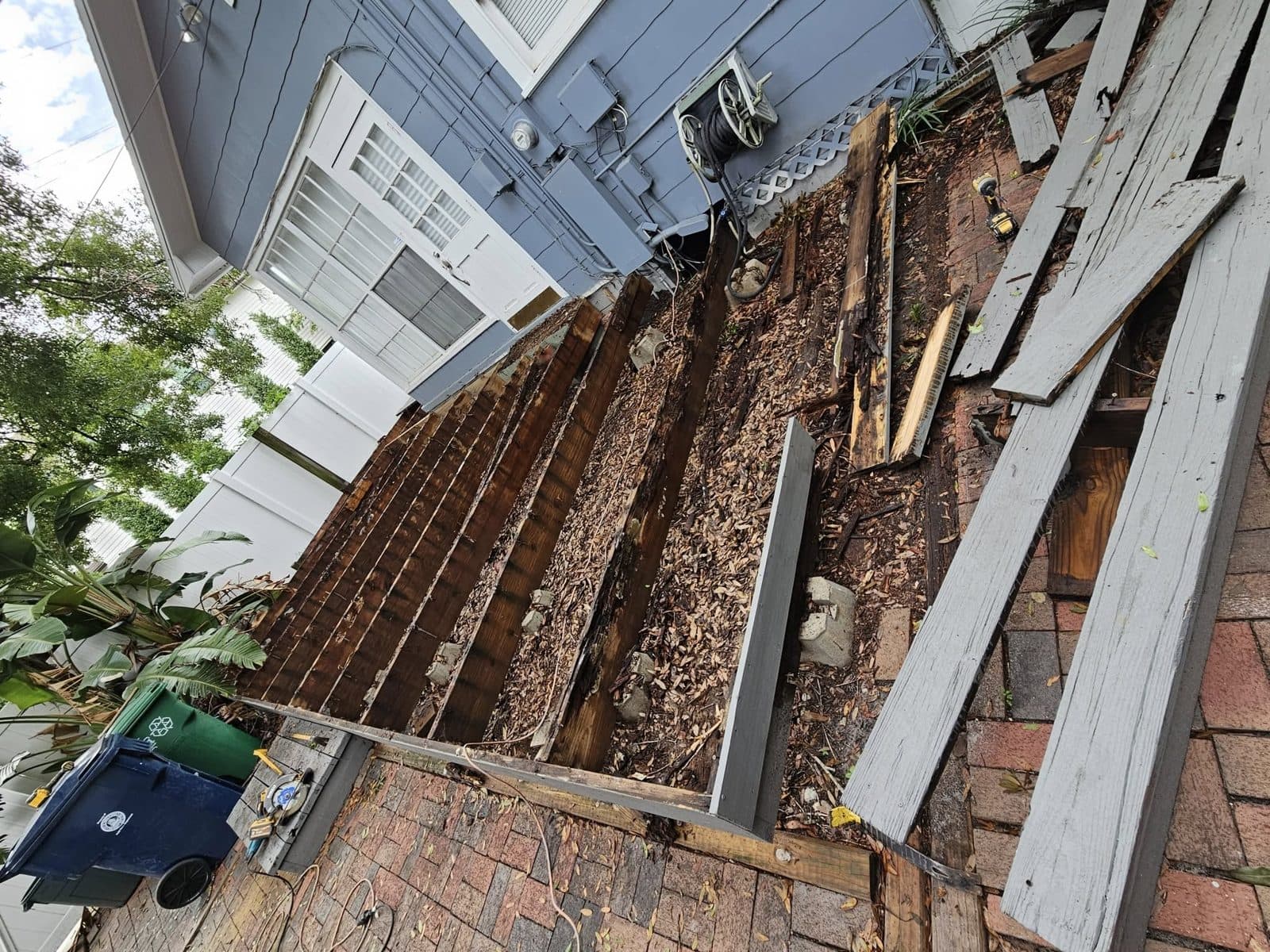 Selective demolition of an old deck in progress by True Carpenters